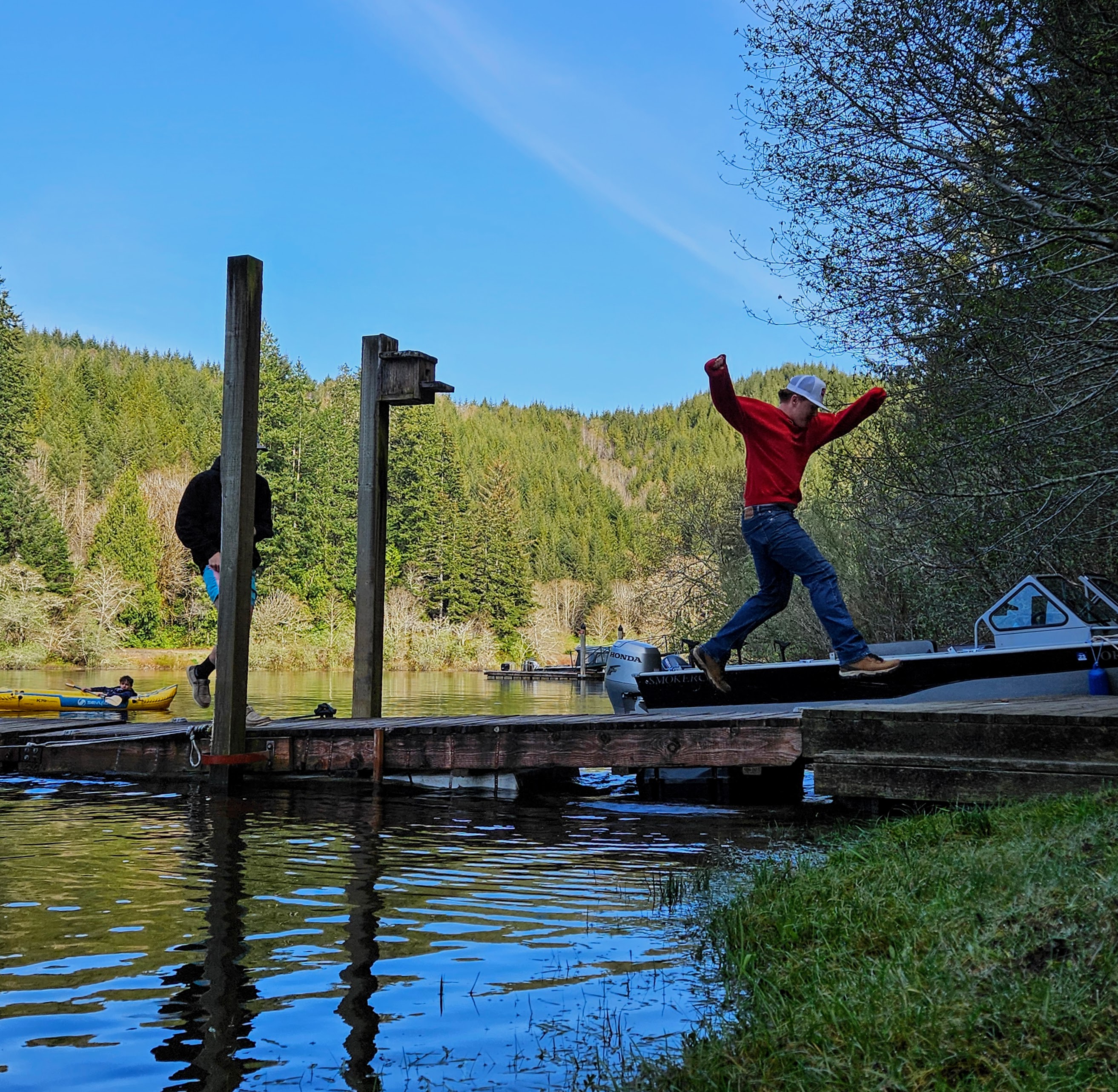 Man jumping while crossing a dock